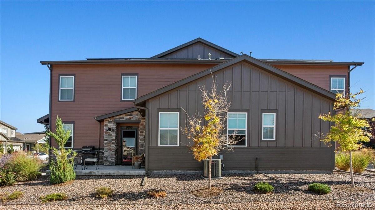 9790 Mount Kataka Point Littleton, CO 80125 - Photo 27 of 32 a front view of a house with garden