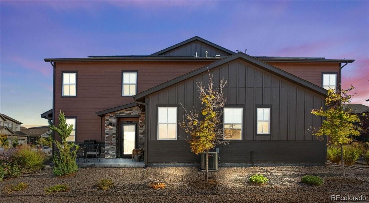 9790 Mount Kataka Point Littleton, CO 80125 - Photo 28 of 32 a front view of a house with garden
