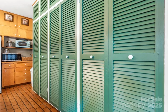 a kitchen with stainless steel appliances granite countertop a sink and a refrigerator