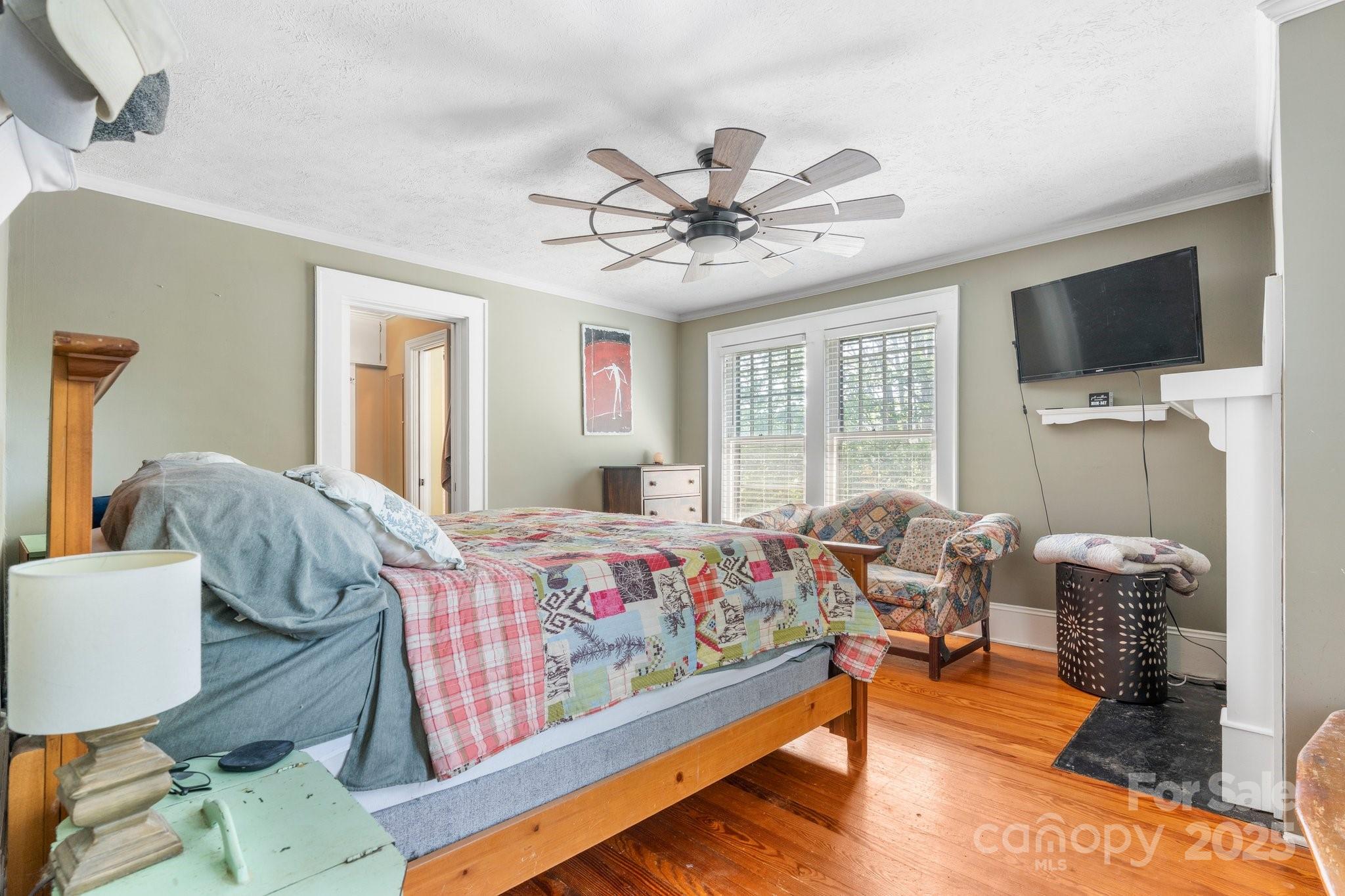 313 East Main Street Morganton, NC 28655 - Photo 21 of 48 a bedroom with furniture and a flat screen tv