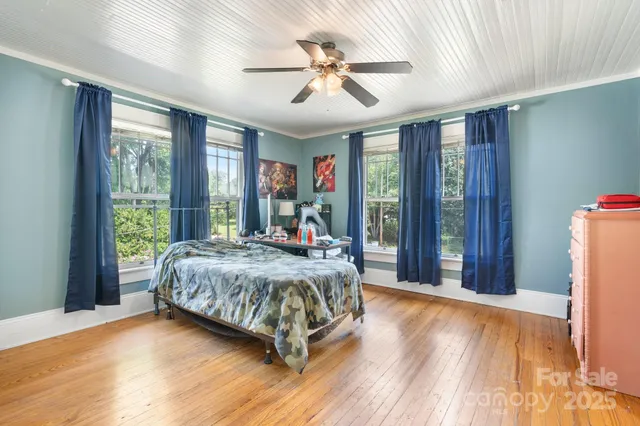 a bedroom with a bed and a fireplace