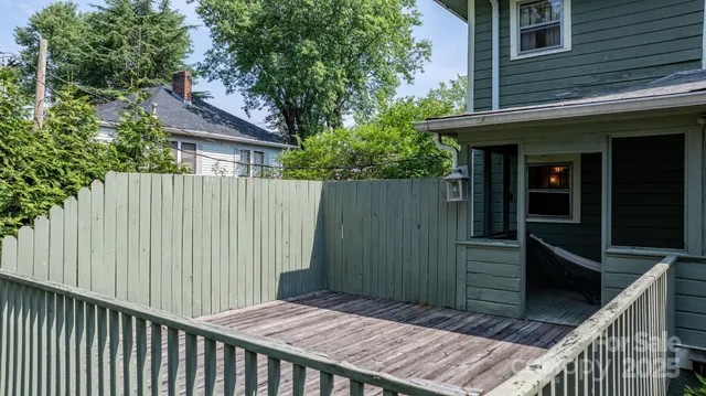 a view of a house with a porch and furniture