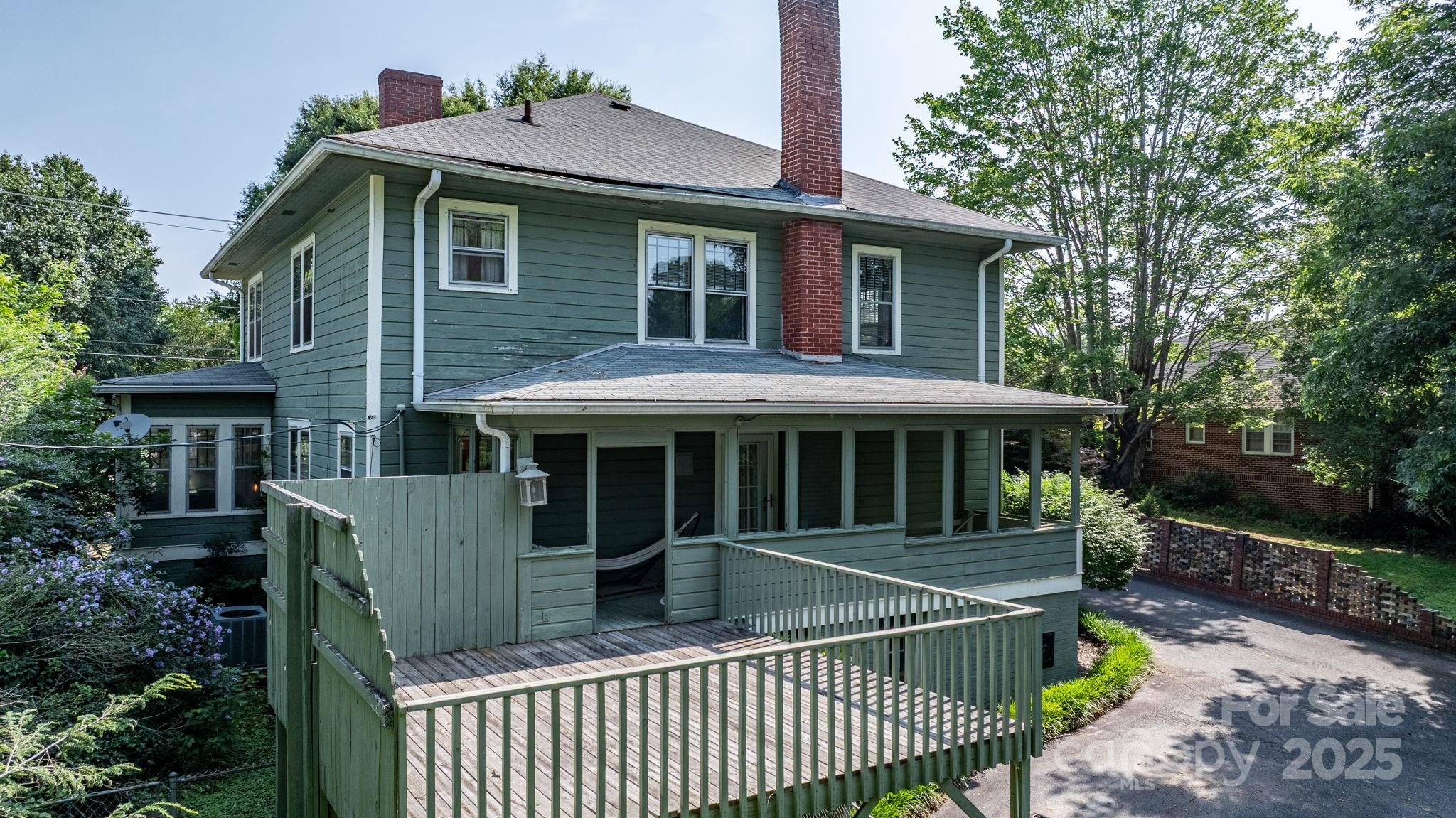 313 East Main Street Morganton, NC 28655 - Photo 38 of 48 a view of a house with a porch and furniture