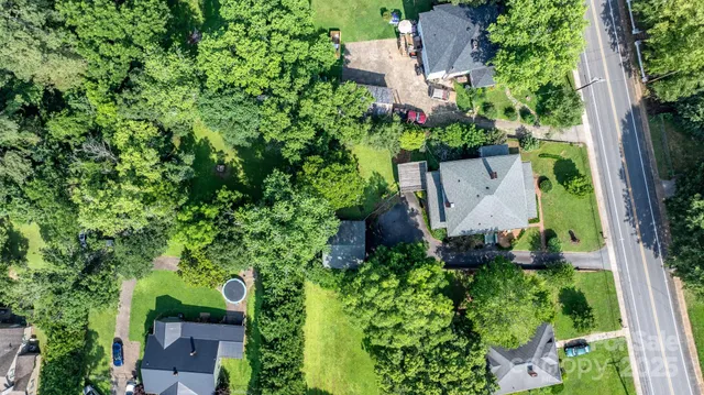 an aerial view of a house with a garden