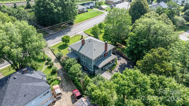 an aerial view of house with yard