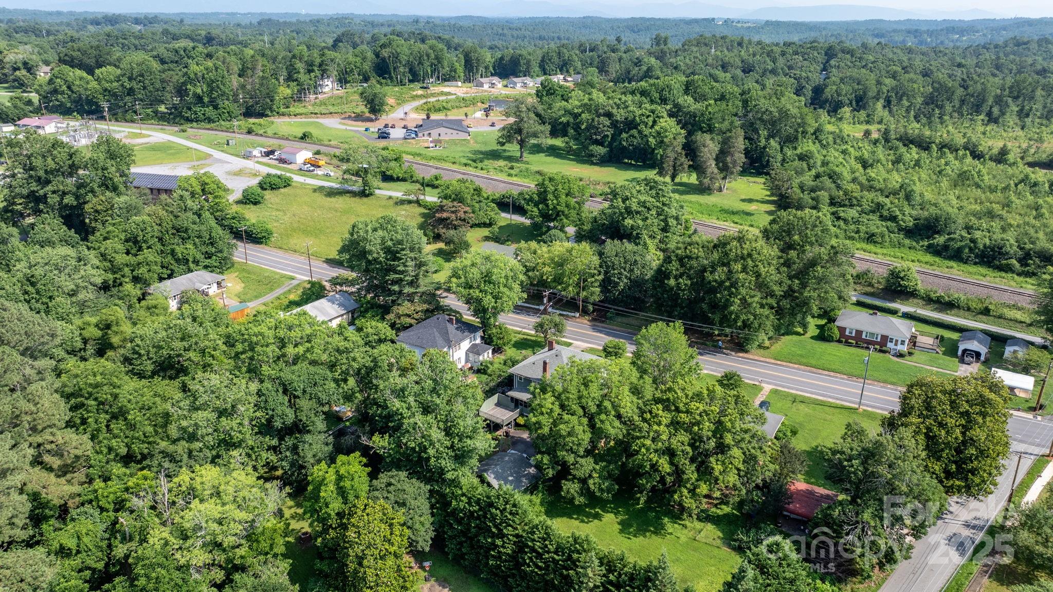 313 East Main Street Morganton, NC 28655 - Photo 46 of 48 an aerial view of residential houses with outdoor space and trees all around