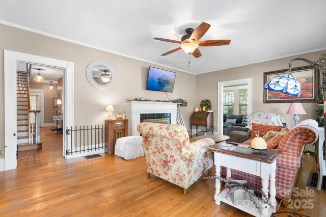 a living room with furniture fireplace and a flat screen tv