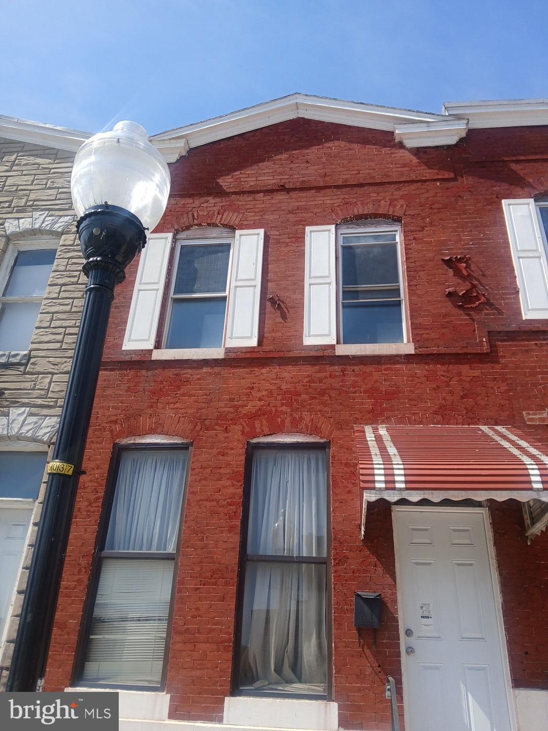 2932 Greenmount Avenue Baltimore, MD 21218 - Photo 1 of 15 a front view of a building