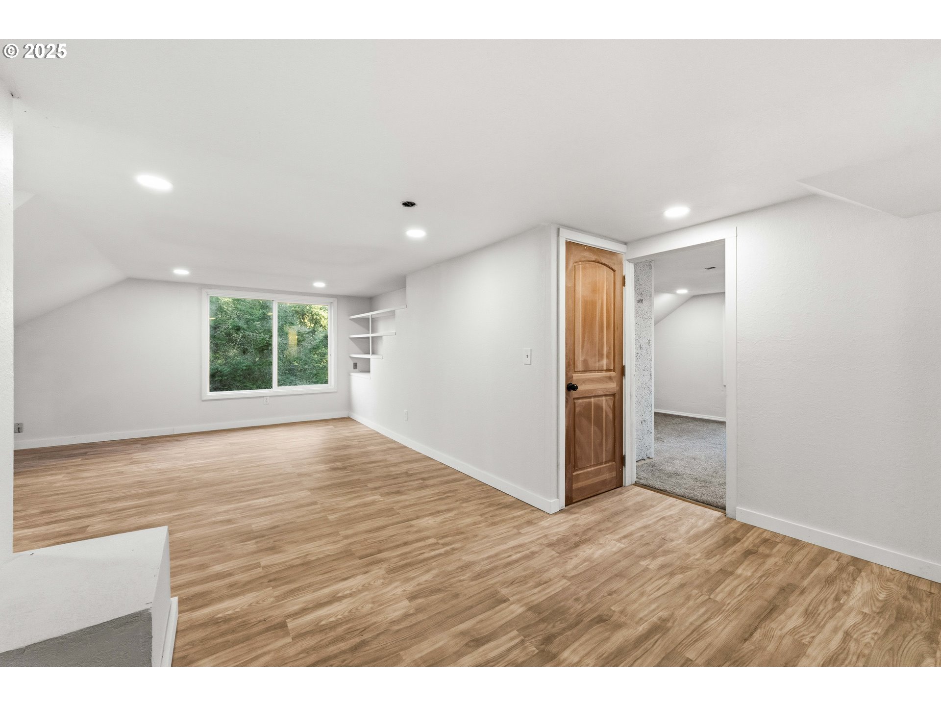 62356 Olive Barber Road Coos Bay, OR 97420 - Photo 26 of 34 a view of an empty room with wooden floor and a window