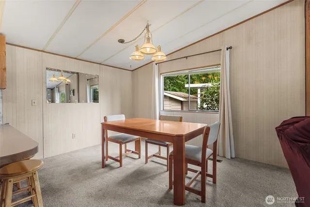 a view of a dining room with furniture window and outside view