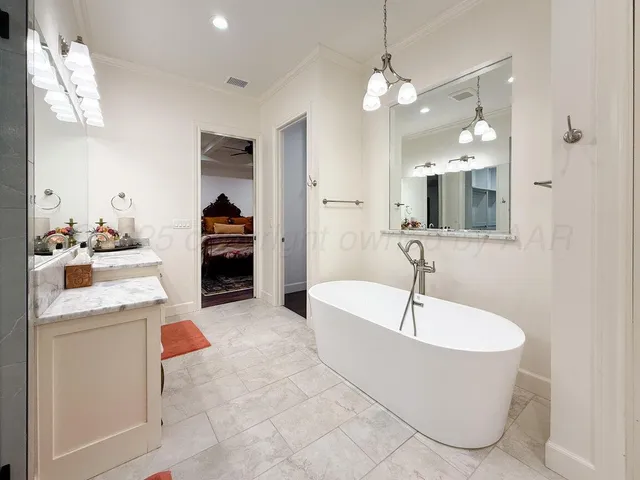 a bathroom with a toilet a sink and a mirror