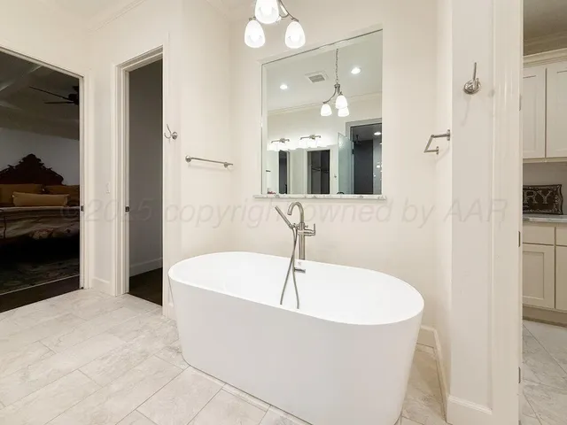 a bathroom with a sink vanity and a mirror