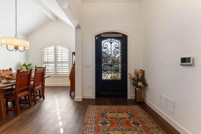 a view of a livingroom with furniture and a window