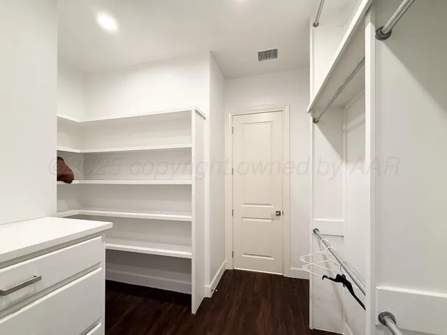 a bathroom with a sink a vanity and a mirror