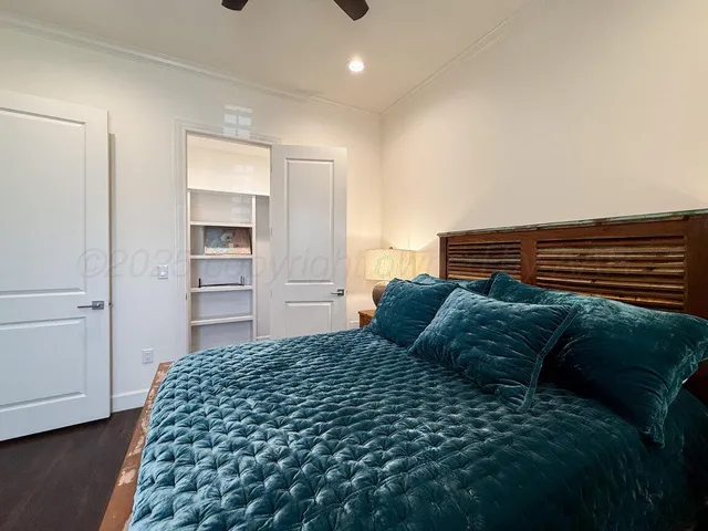 a kitchen with cabinets appliances and a window