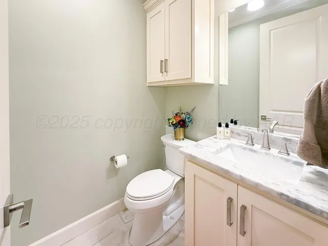 a utility room with sink dryer and washer