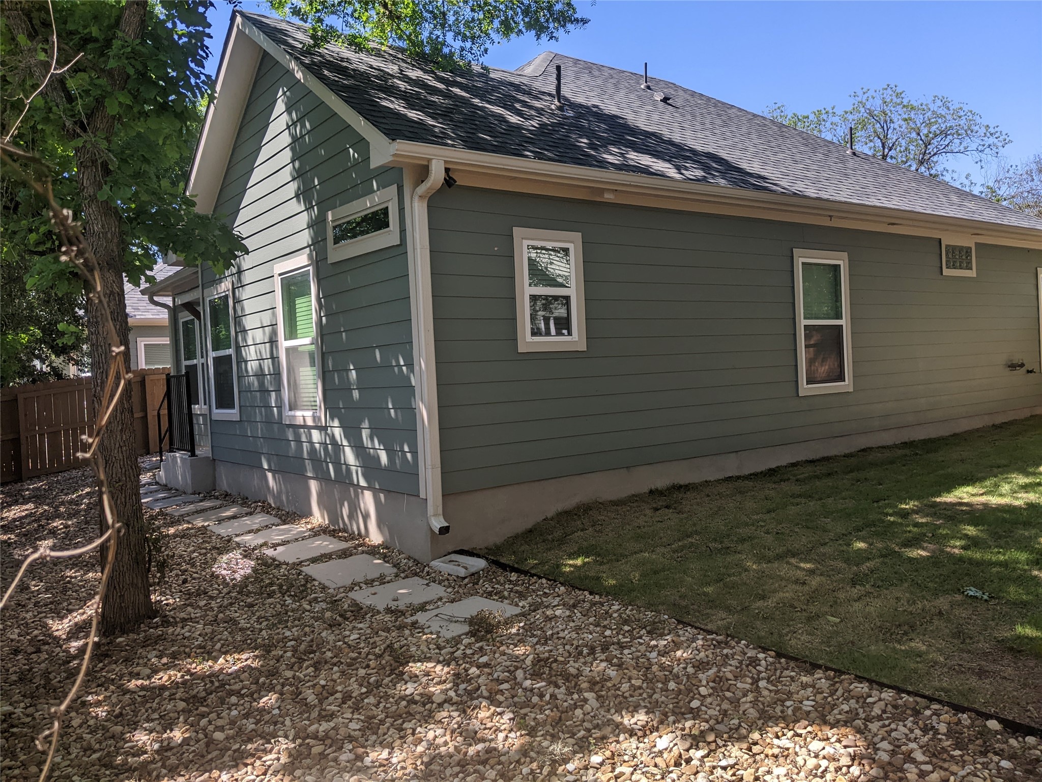 906 Kate Street, Unit A Lockhart, TX 78644 - Photo 14 of 15 View of side of home with roof shade trees