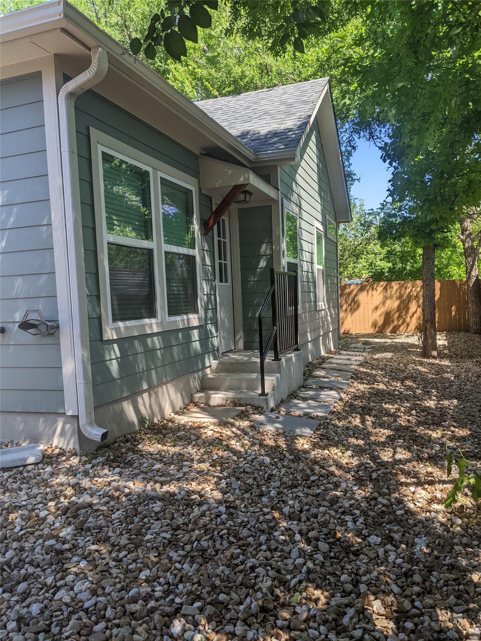 906 Kate Street, Unit A Lockhart, TX 78644 - Photo 2 of 15 View of side of property featuring shaded trees for the yard