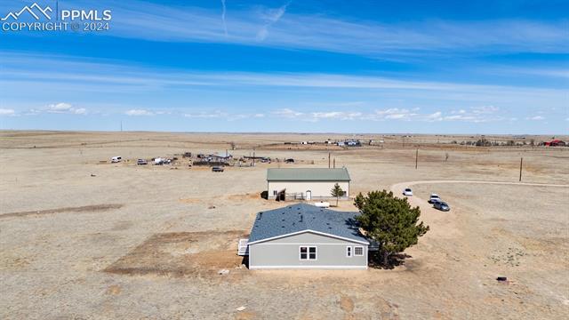 8160 Edison Road Yoder, CO 80864 - Photo 6 of 42 Drone / aerial view with a rural view