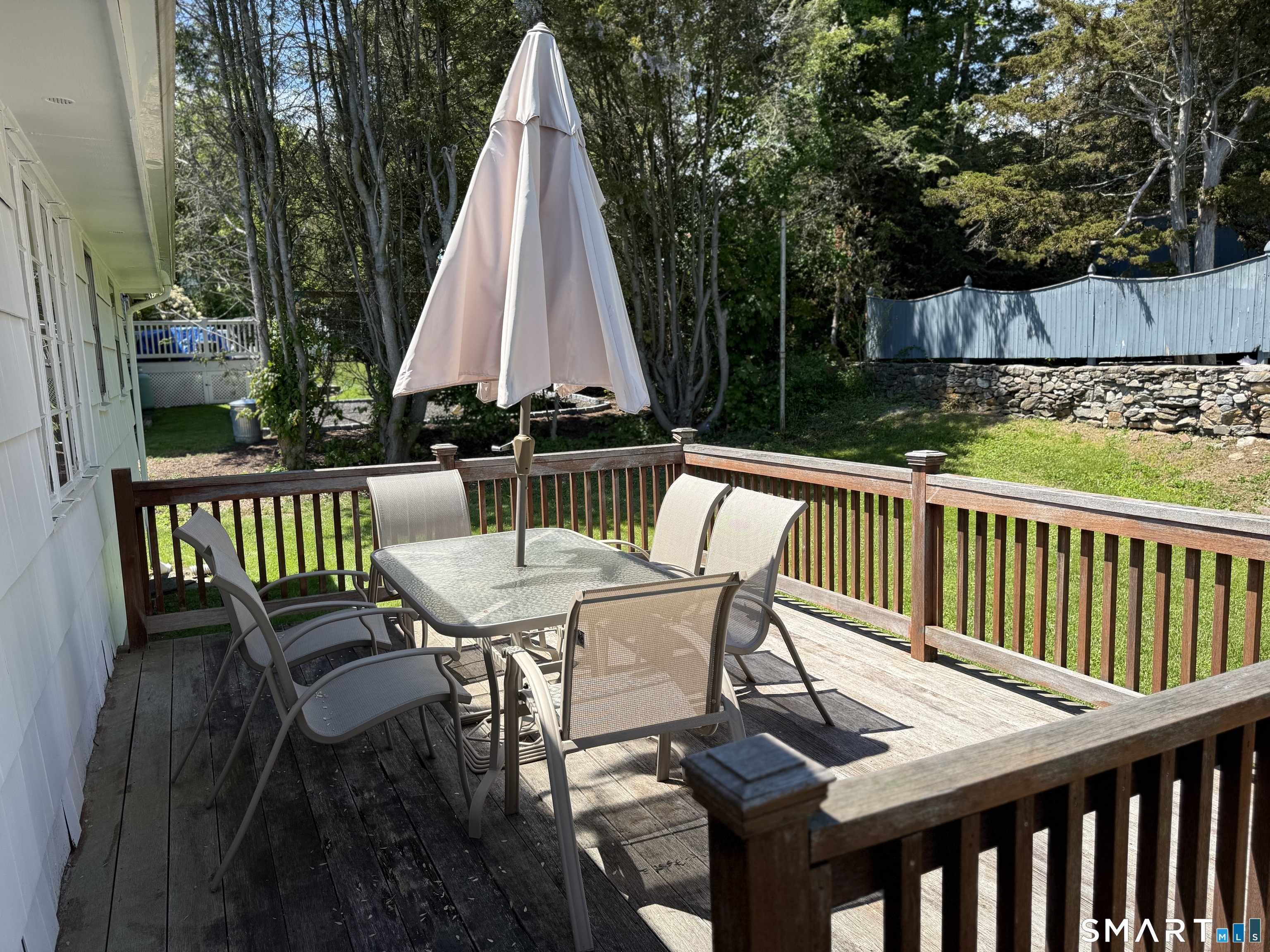 26 Maple Street Trumbull, CT 06611 - Photo 8 of 37 a view of a patio with two chairs and a table