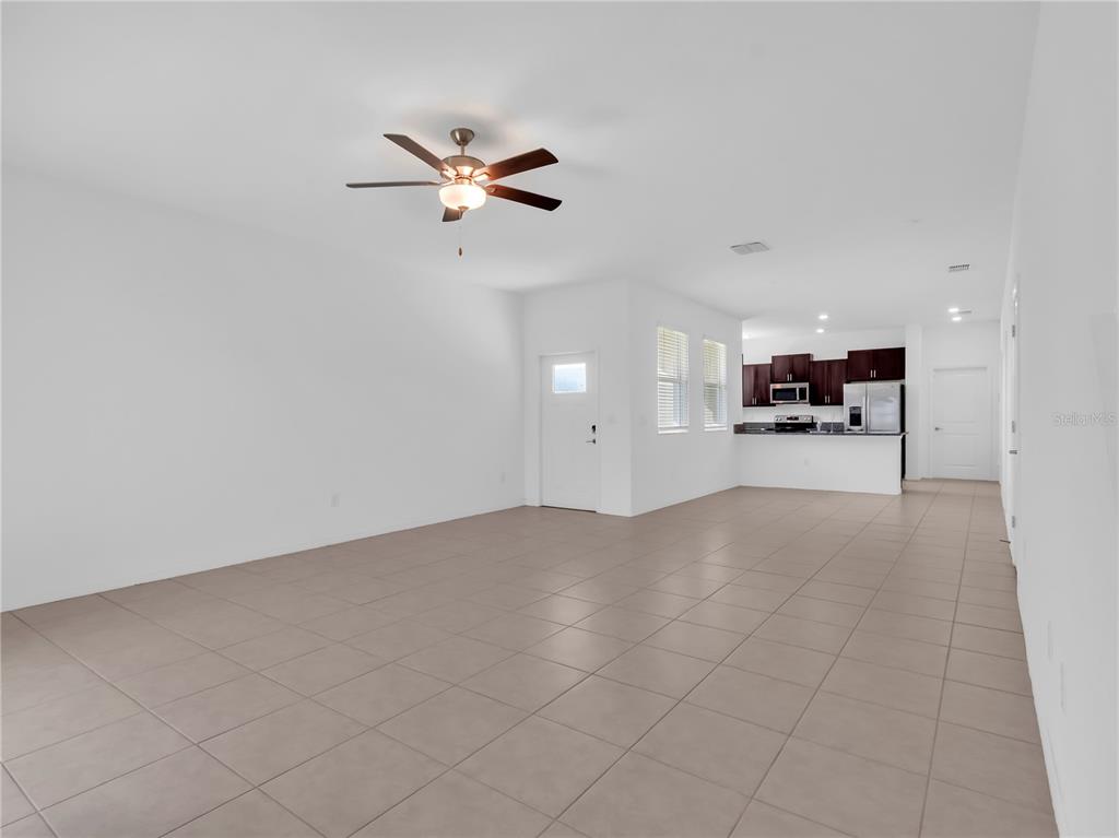 12408 Crystal Jade Way Parrish, FL 34219 - Photo 15 of 51 an empty room with a cabinet and mirrors
