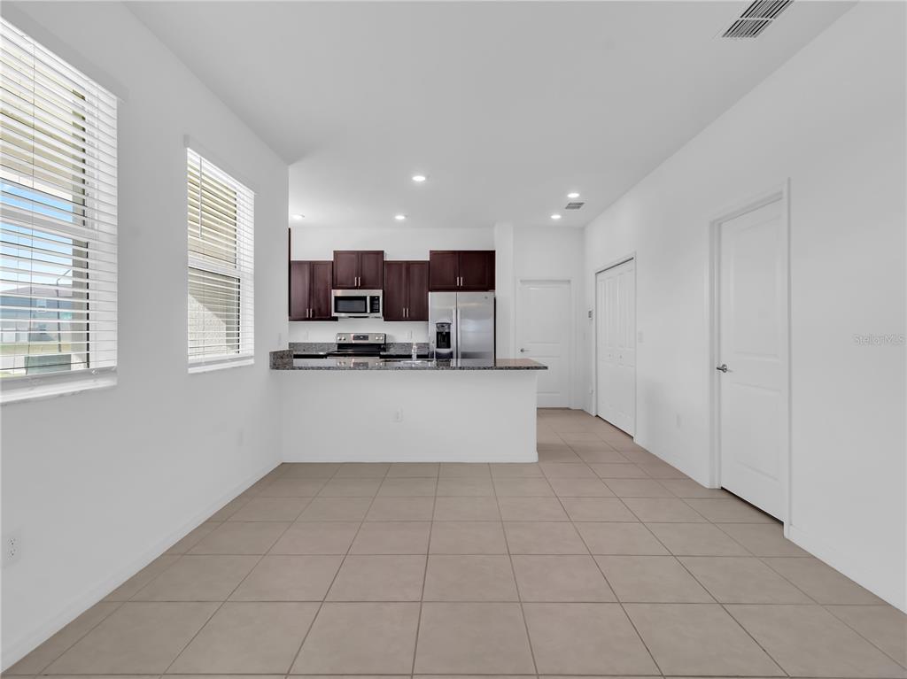 12408 Crystal Jade Way Parrish, FL 34219 - Photo 16 of 51 a view of kitchen with stainless steel appliances cabinets