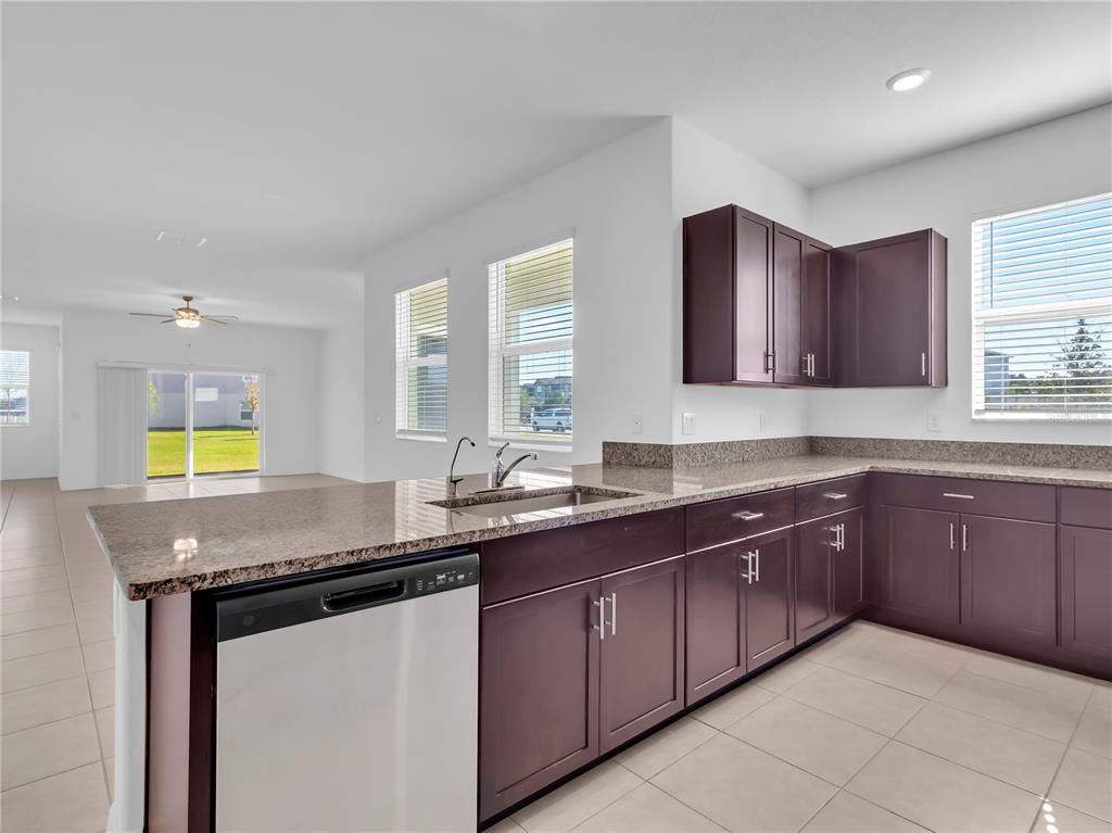 12408 Crystal Jade Way Parrish, FL 34219 - Photo 19 of 51 a kitchen with a sink and cabinets