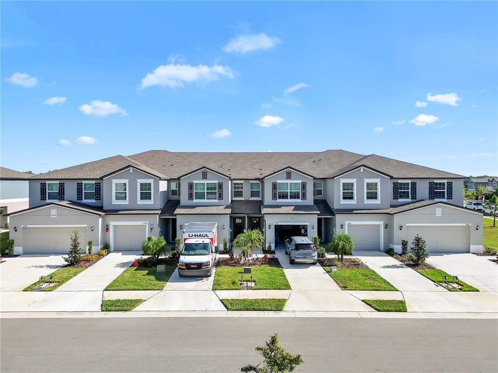 12408 Crystal Jade Way Parrish, FL 34219 - Photo 37 of 51 a front view of a house with a yard table and chairs