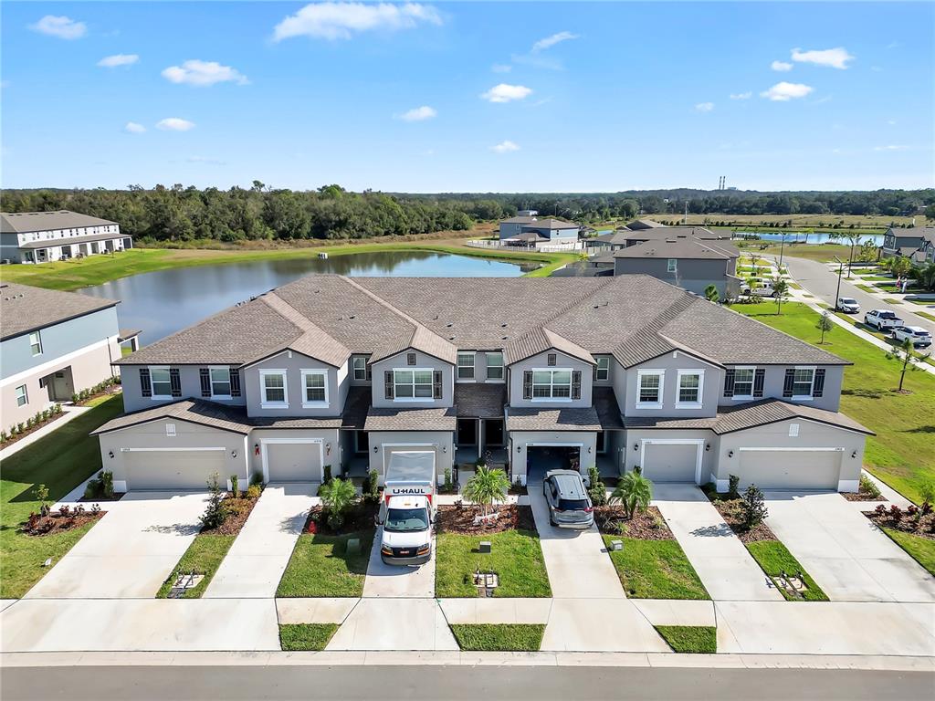 12408 Crystal Jade Way Parrish, FL 34219 - Photo 39 of 51 an aerial view of a house with a garden and lake view