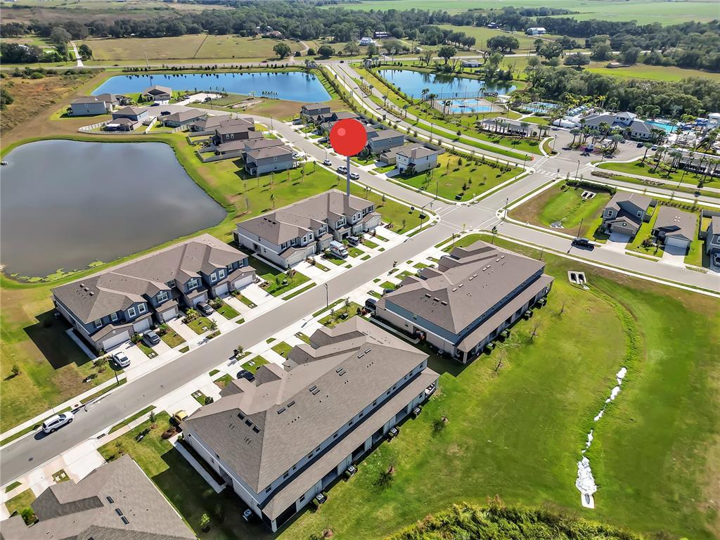12408 Crystal Jade Way Parrish, FL 34219 - Photo 48 of 51 an aerial view of a resort with swimming pool and outdoor seating