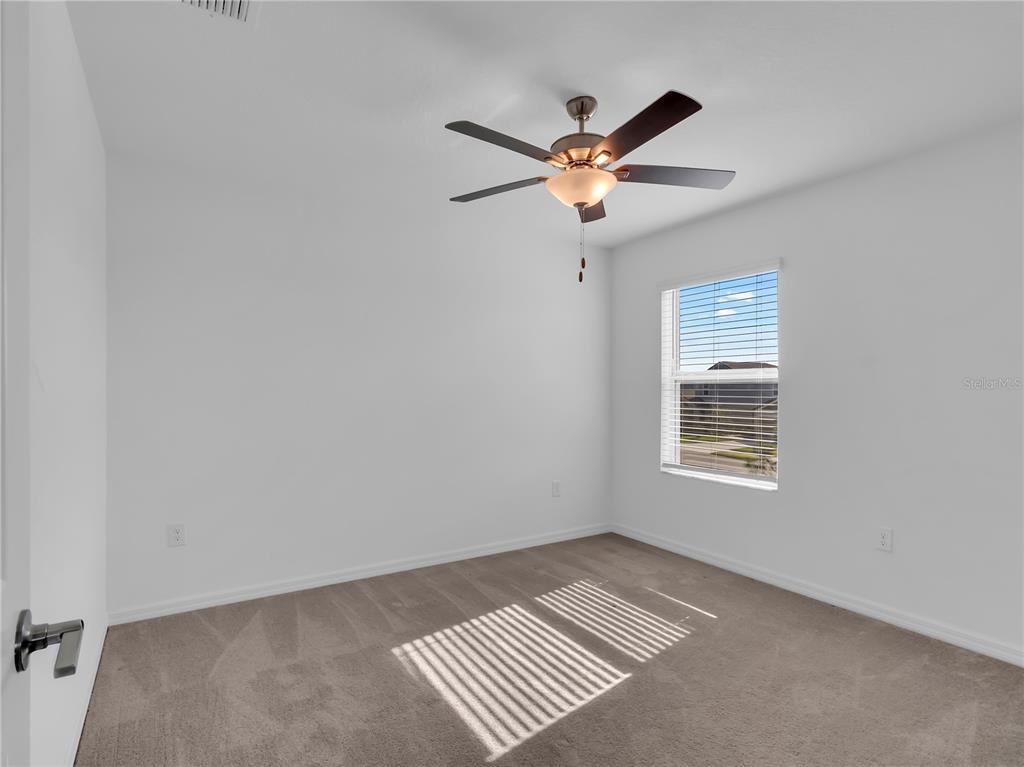 12408 Crystal Jade Way Parrish, FL 34219 - Photo 6 of 51 a view of an empty room with a window