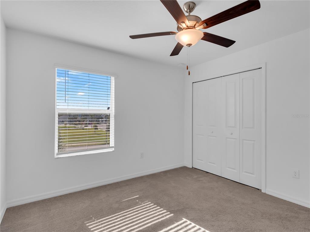 12408 Crystal Jade Way Parrish, FL 34219 - Photo 7 of 51 a view of an empty room with a window