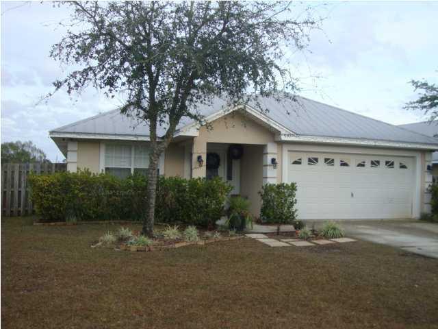 197 South Harborview Road Santa Rosa Beach, FL 32459 - Photo 1 of 1 a front view of a house with a yard and garage
