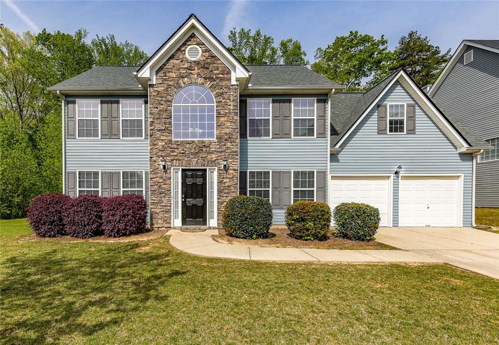 2226 Corkscrew Way Villa Rica, GA 30180 - Photo 1 of 1 a front view of a house with a yard