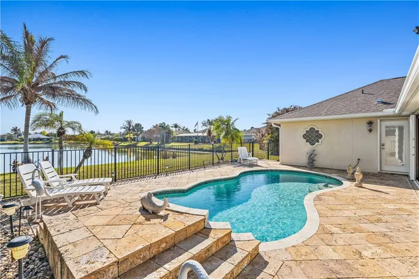 a view of a swimming pool with a lounge chair