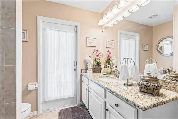 a bathroom with sink and mirror