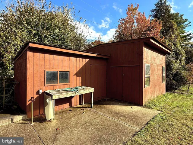 a backyard of a house with seating space
