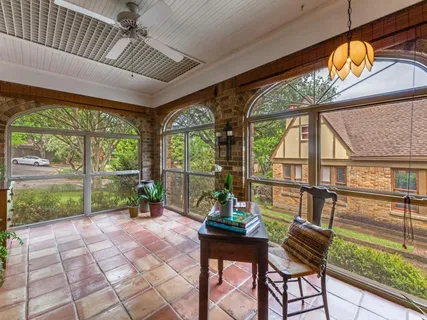 a view of a dining room with furniture wooden floor and a chandelier