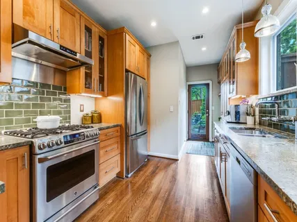 a kitchen with sink and window
