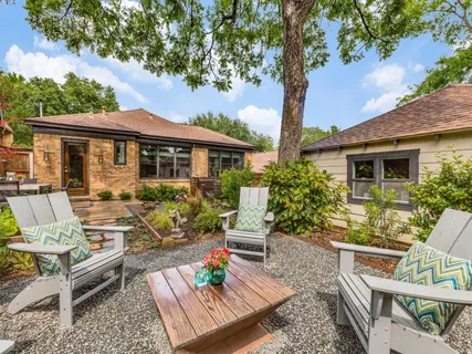 a front view of a house with garden