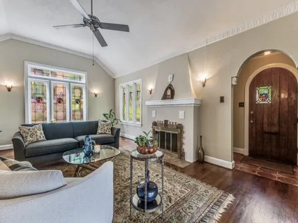 a living room with furniture and a fireplace