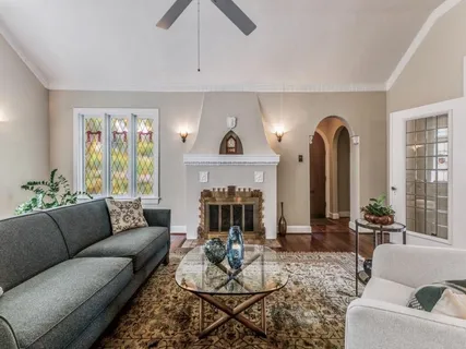 a living room with furniture and a fireplace
