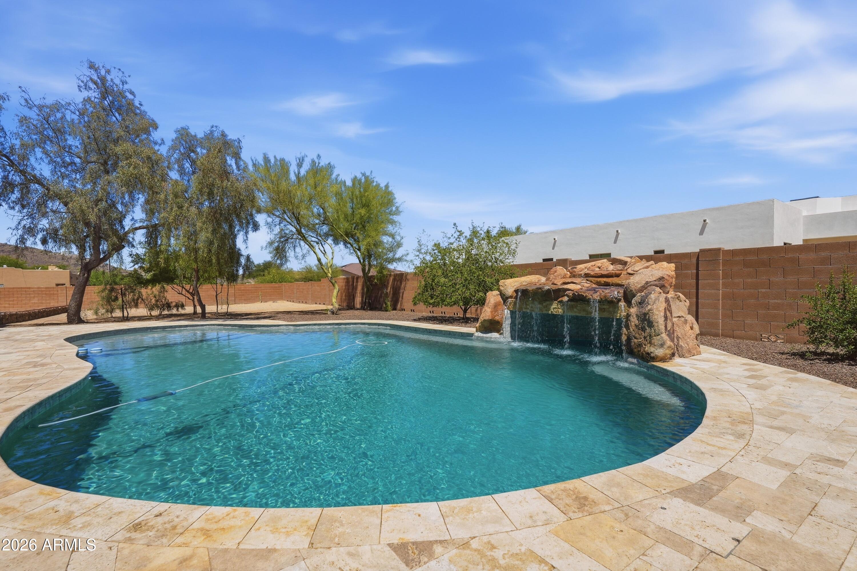 2616 West Canyon Road Phoenix, AZ 85086 - Photo 29 of 45 a view of a swimming pool with a yard