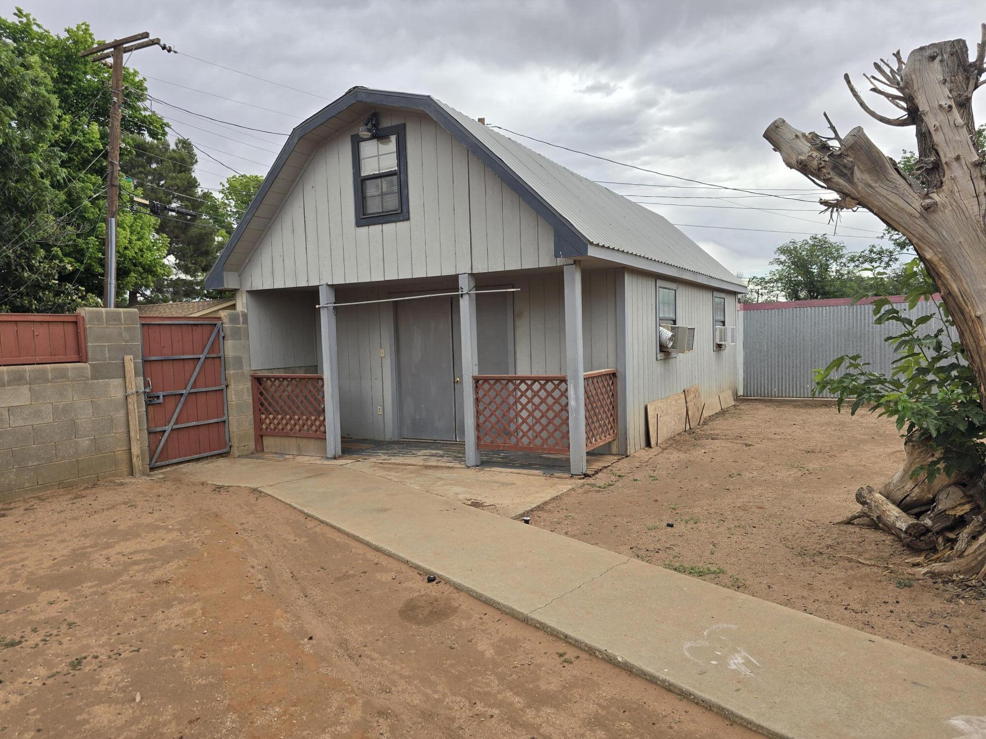 506 North 19th Street Lamesa, TX 79331 - Photo 25 of 29 a front view of a house with a yard and garage