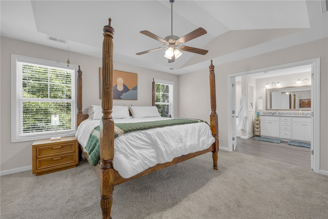 430 Johnson Road Central, SC 29630 - Photo 12 of 36 A spacious sleeping area with tray ceilings opens into an adjacent well-appointed bath.