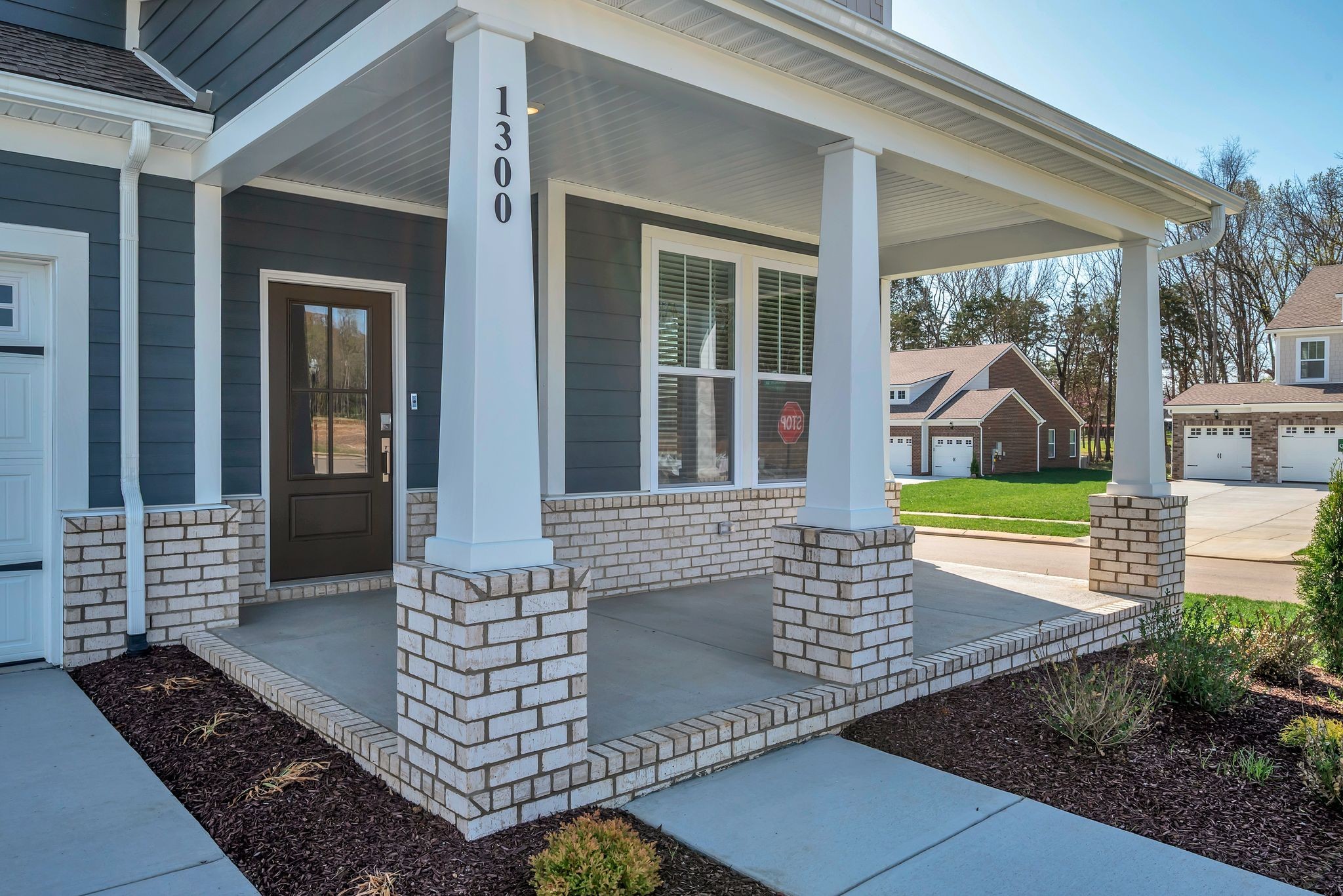 a view of front door of house with outdoor seating