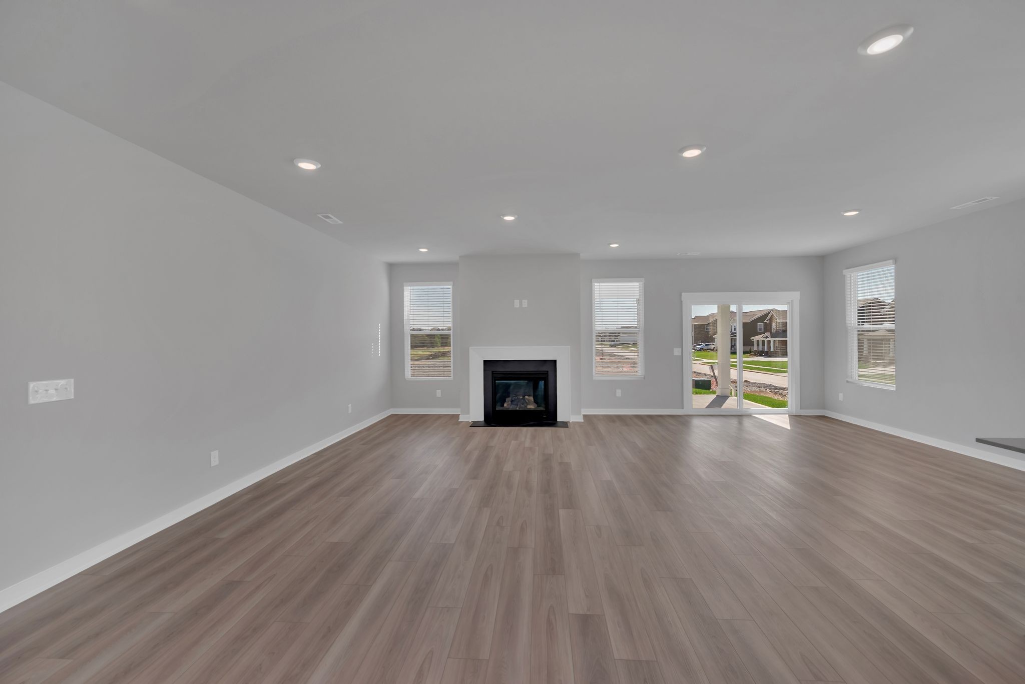 1300 Branch Street Lebanon, TN 37087 - Photo 14 of 43 an empty room with wooden floor and fireplace