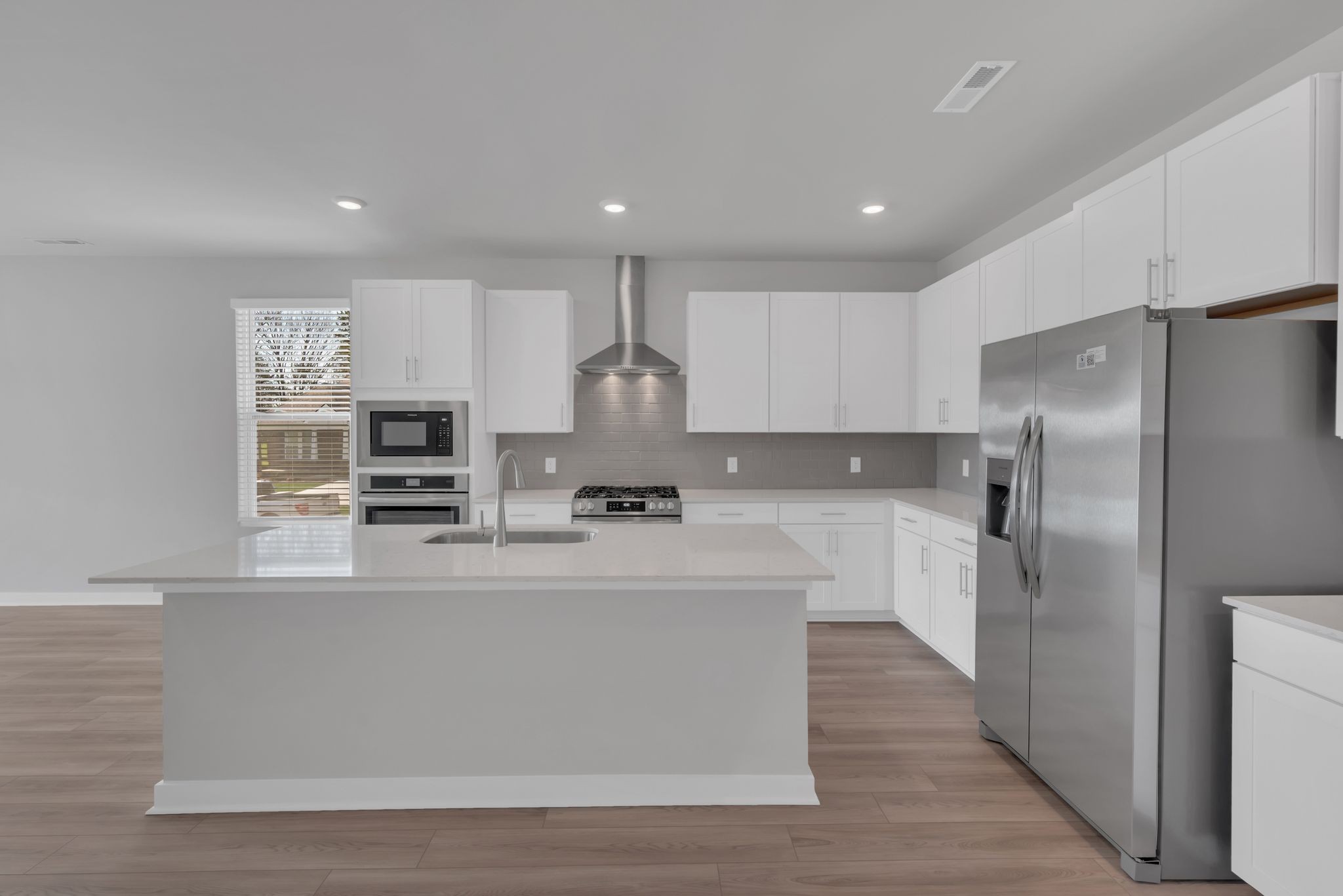 1300 Branch Street Lebanon, TN 37087 - Photo 20 of 43 a large kitchen with stainless steel appliances a refrigerator a stove microwave and sink