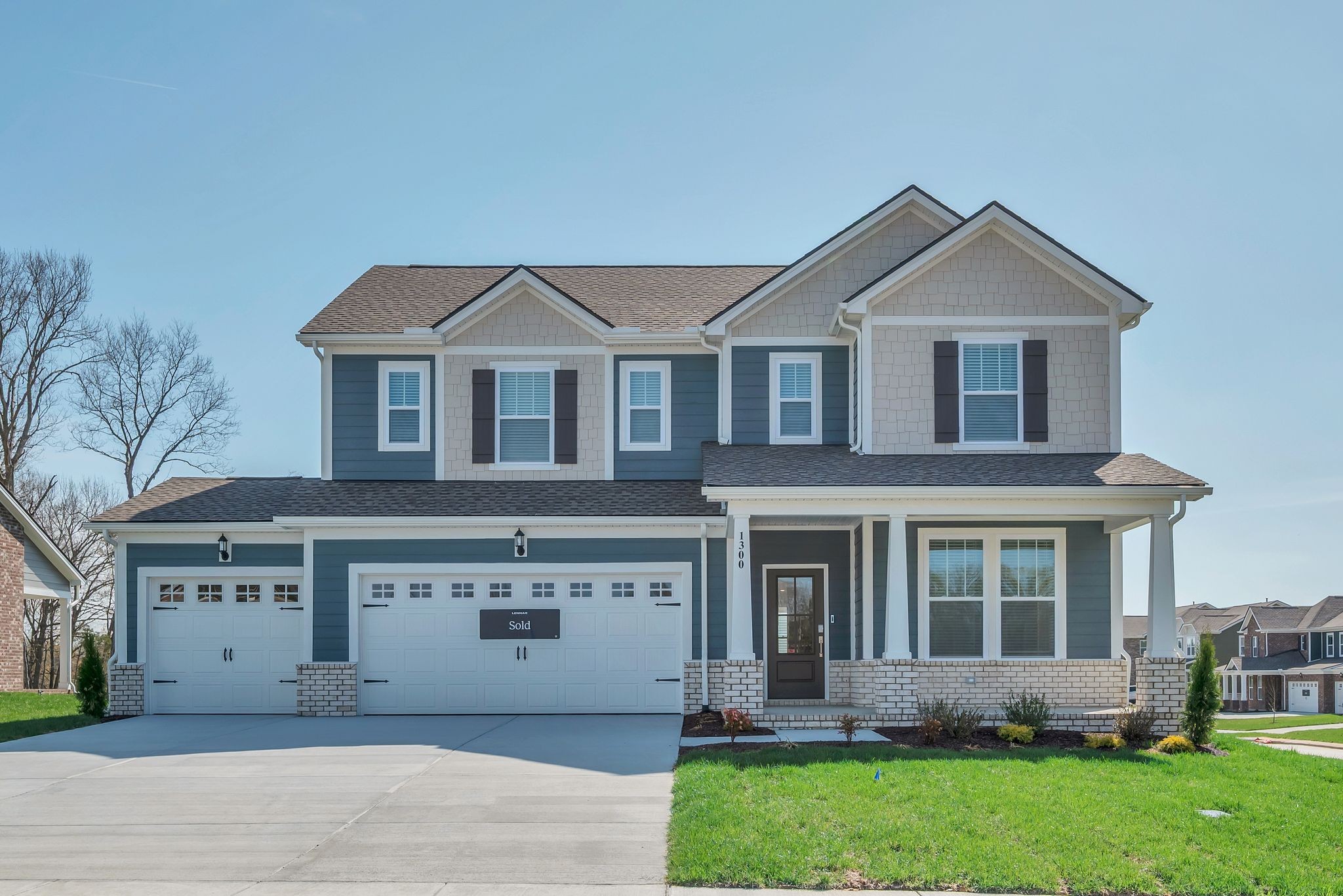 1300 Branch Street Lebanon, TN 37087 - Photo 3 of 43 a front view of a house with a yard and garage