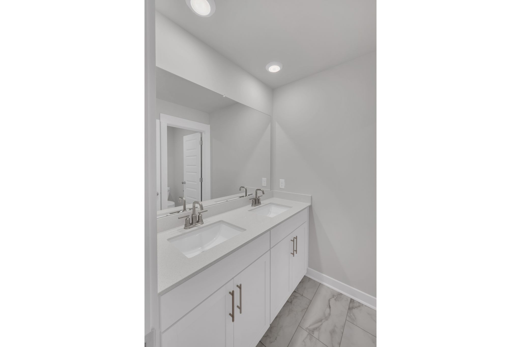 1300 Branch Street Lebanon, TN 37087 - Photo 31 of 43 a bathroom with a double vanity sink and mirror